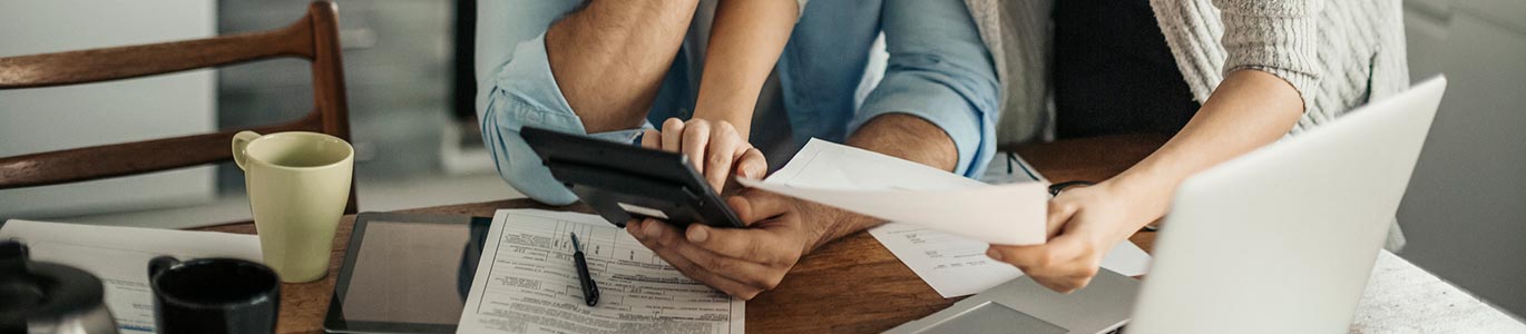 A couple going over financials in their kitchen